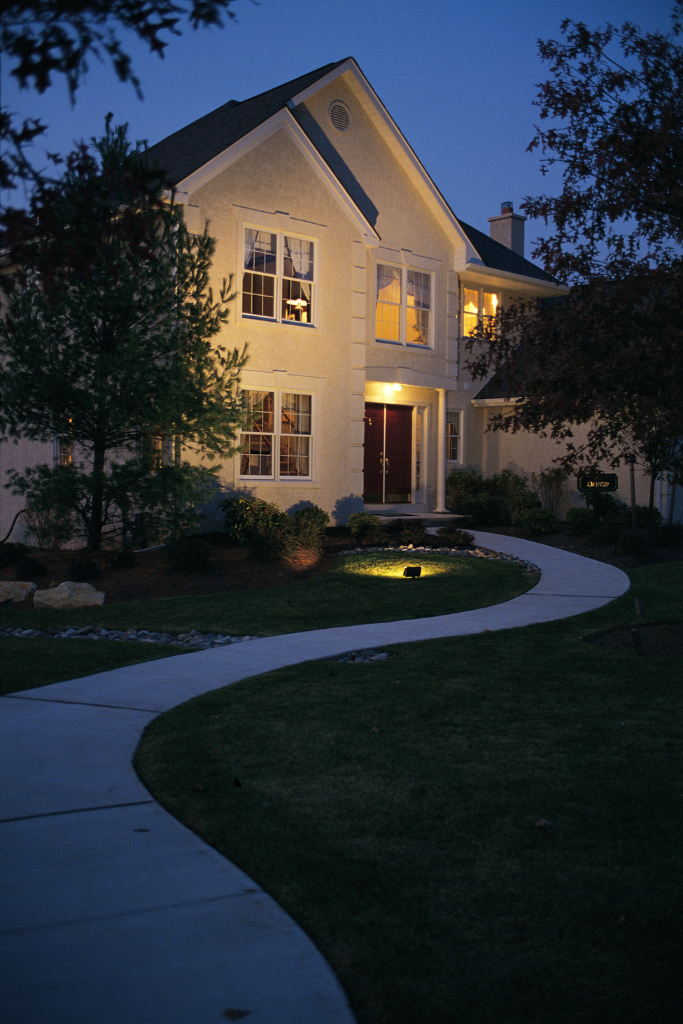 Home exterior lit at night